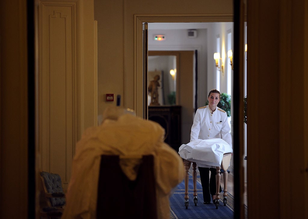 A maid changing linens