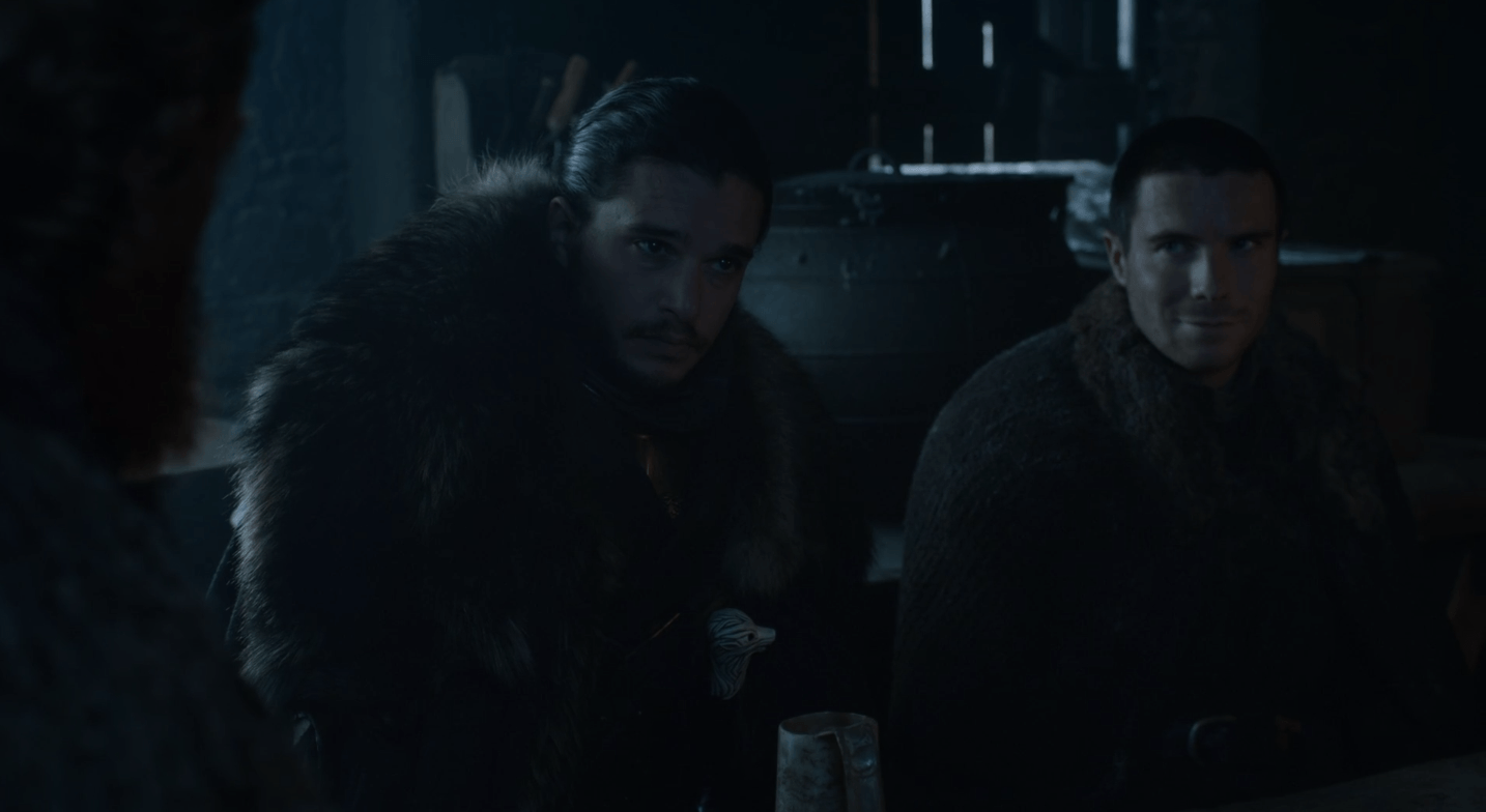 Jon Snow and Gendry sit at a table. In the 'Game of Thrones' episode 'Eastwatch,' Jon Snow and Gendry sit at a table.