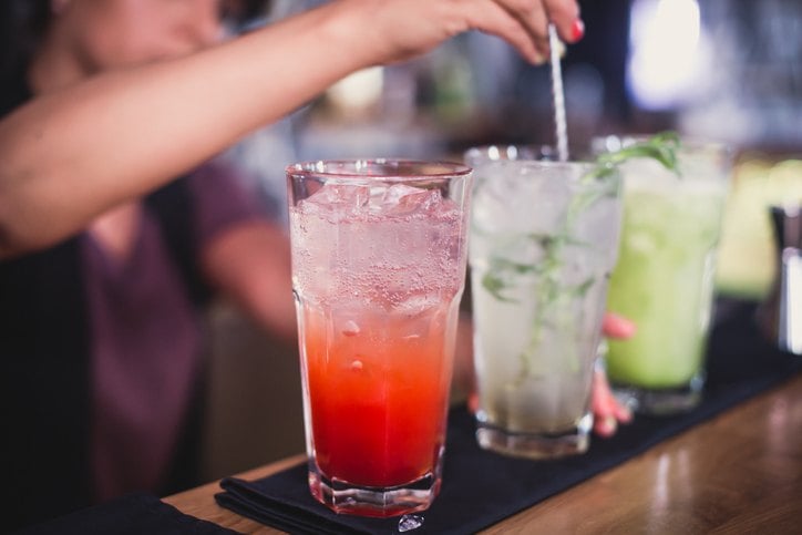 glasses and shots with different colored cocktails