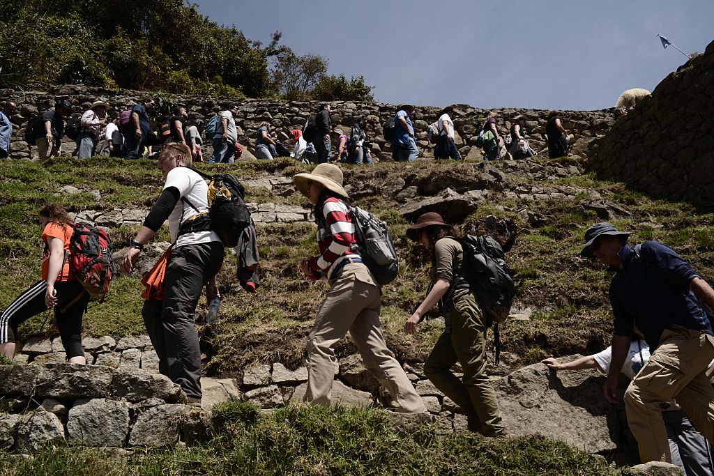 tourists visit Machu Picchu