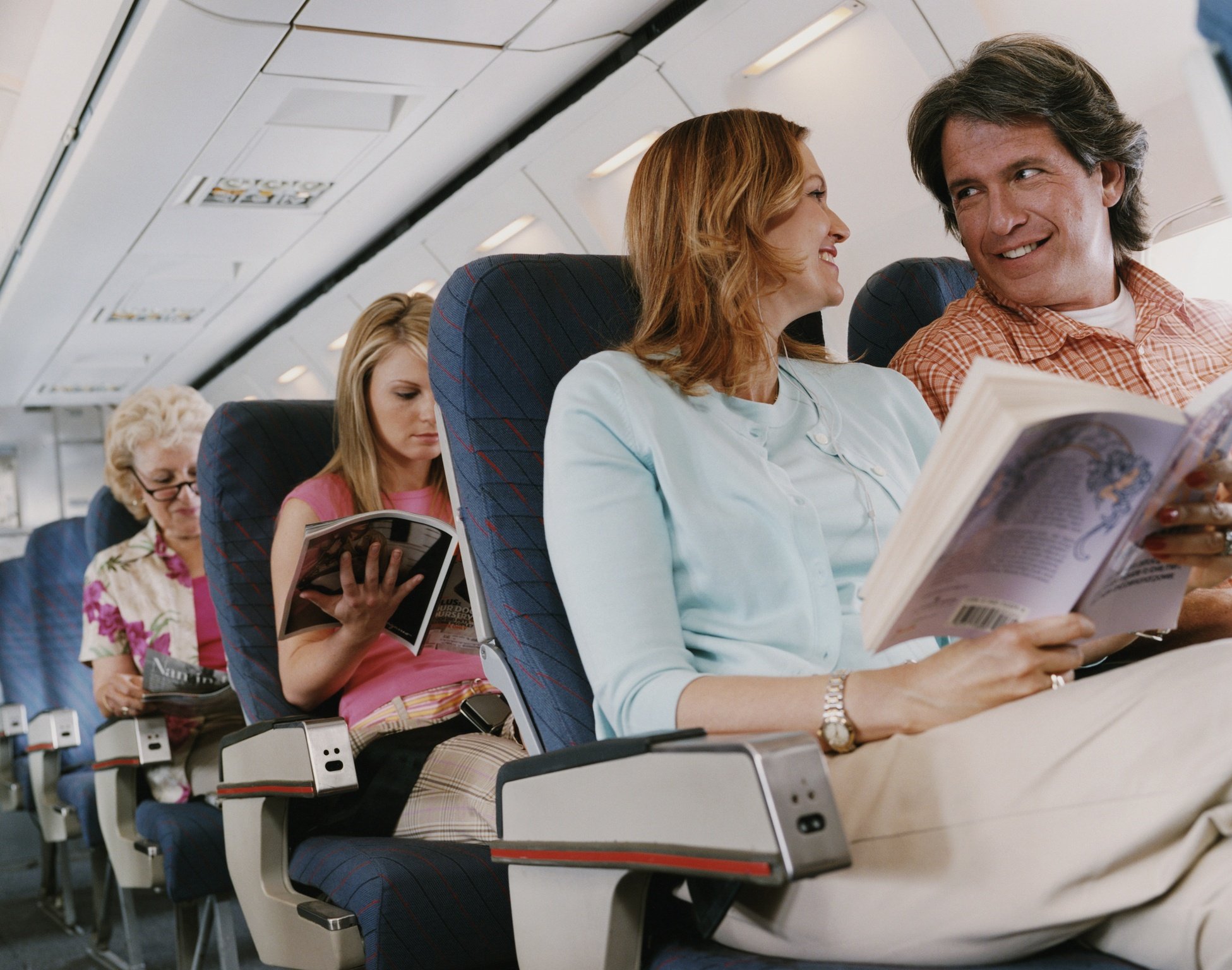 Couple talking on an airplane