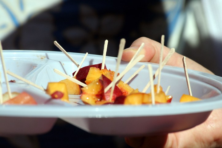 people sampling peach