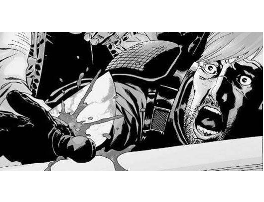 Rick watches as his hand gets cut off in 'The Walking Dead' comics. Stunned, Rick watches as the Governor cuts off his hand in 'The Walking Dead' comics.