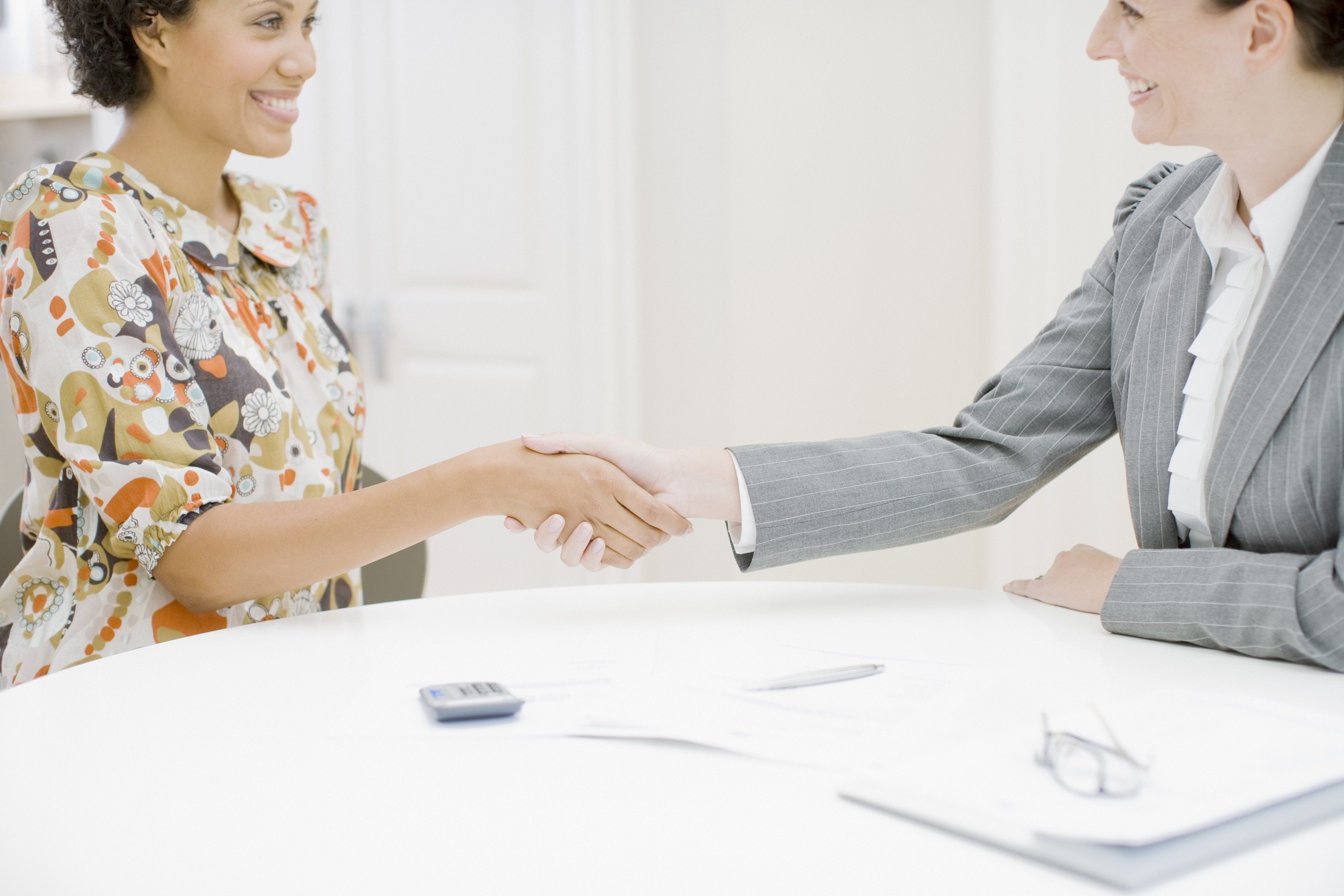 Sales woman shaking hands