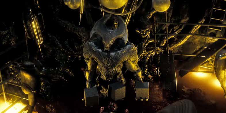 Steppenwolf holds three black boxes in his hands in Justice League Steppenwolf holds three black boxes in his hands in Justice League