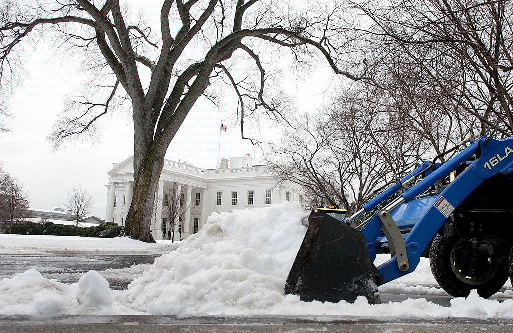 U.S. Park Service personnel clear the streets in front of the West Wing
