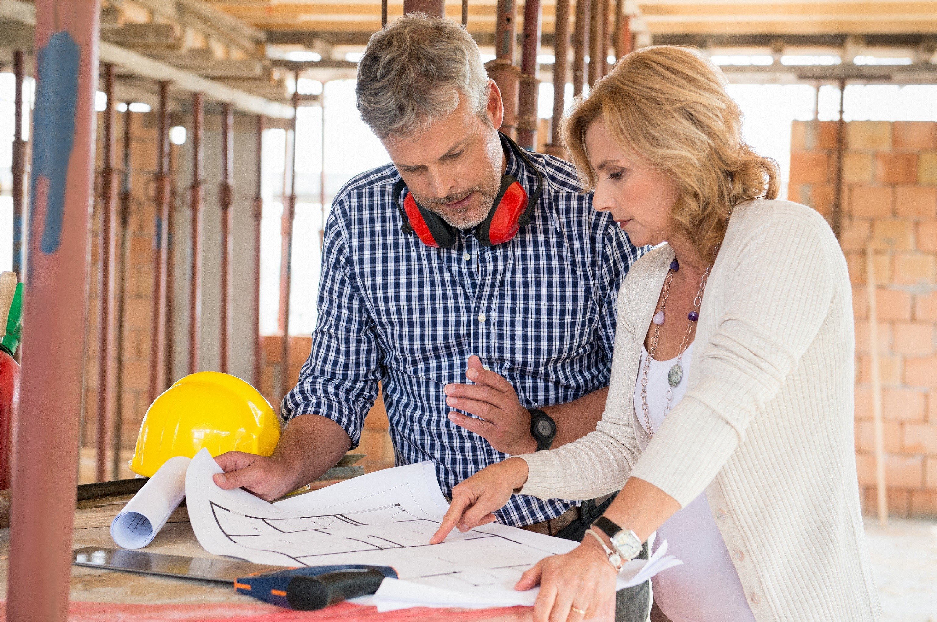 Man and woman discussing construction