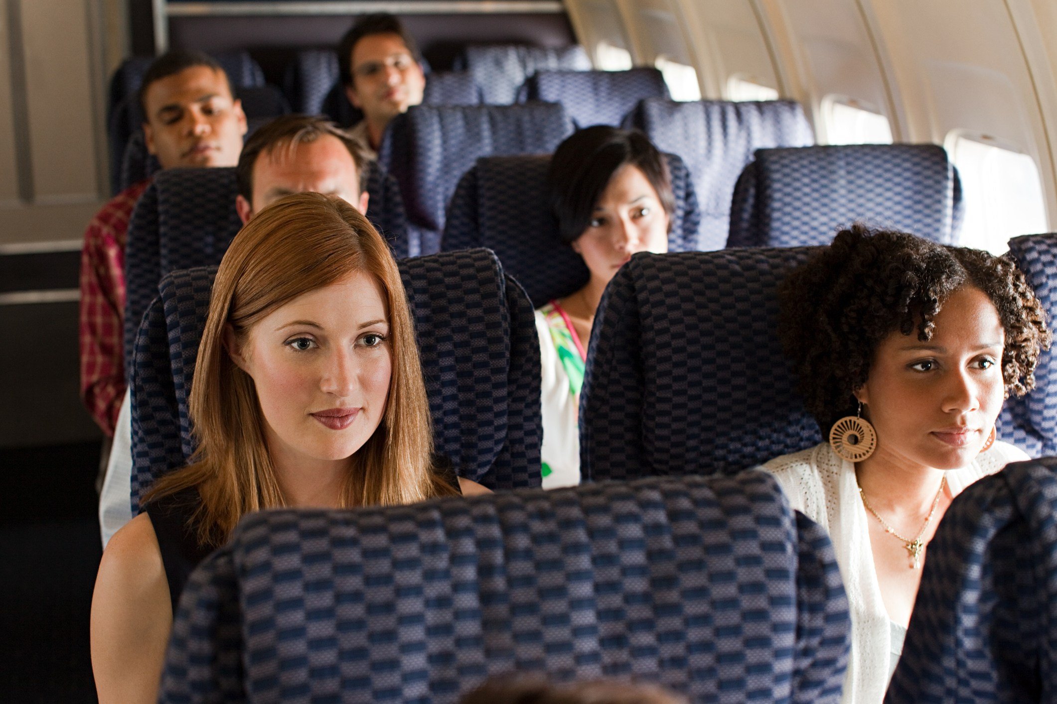 passengers sitting on an airplane