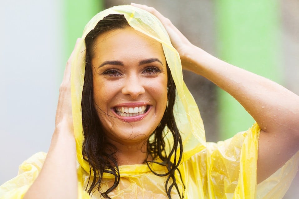 young woman in raincoat outdoors