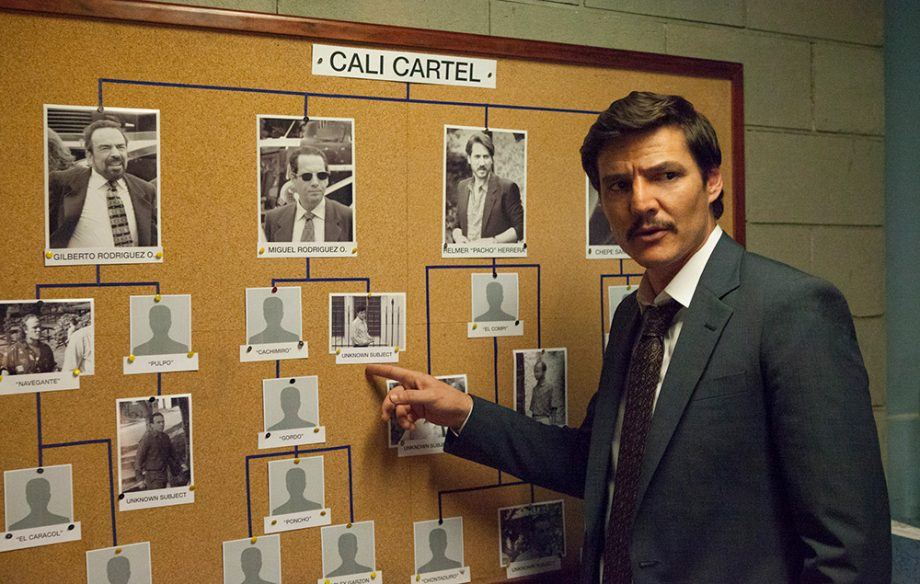 A man points to a bulletin board in Narcos Season 3 A man points to a bulletin board in Narcos Season 3