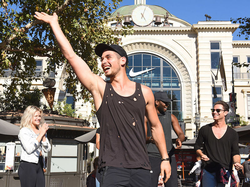 Alan Bersten waves at fans outside a Nike store. Alan Bersten waves at fans outside a Nike store.