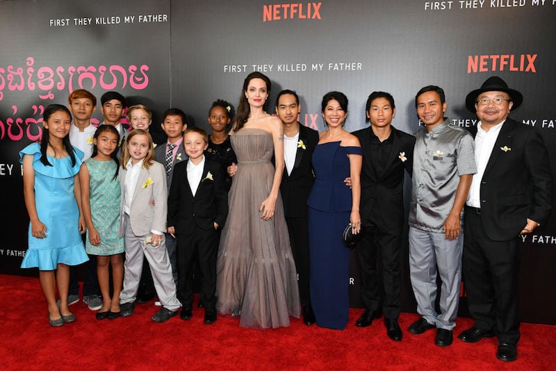 Angelina Jolie poses with her family on the red carpet. Angelina Jolie poses with her family on the red carpet.