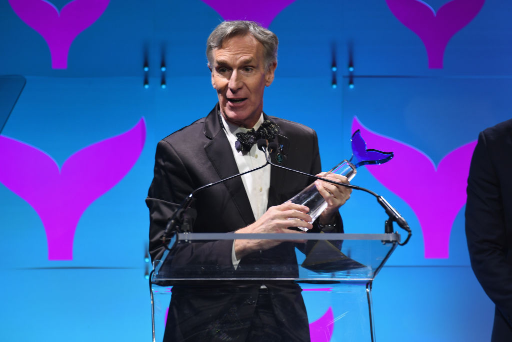 Bill Nye holds a trophy at the Shorty Awards. 