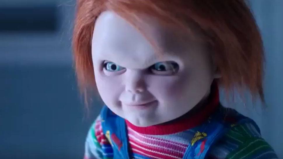 Chucky stares ahead with an evil smile