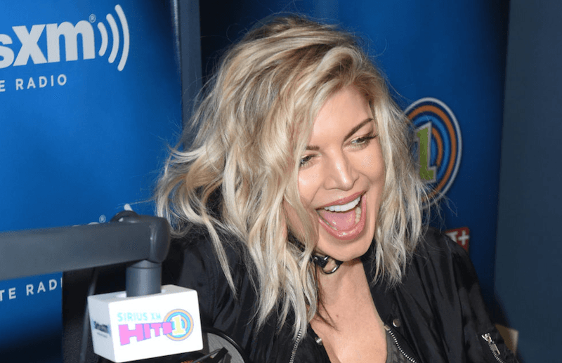 Fergie laughs during a radio interview.