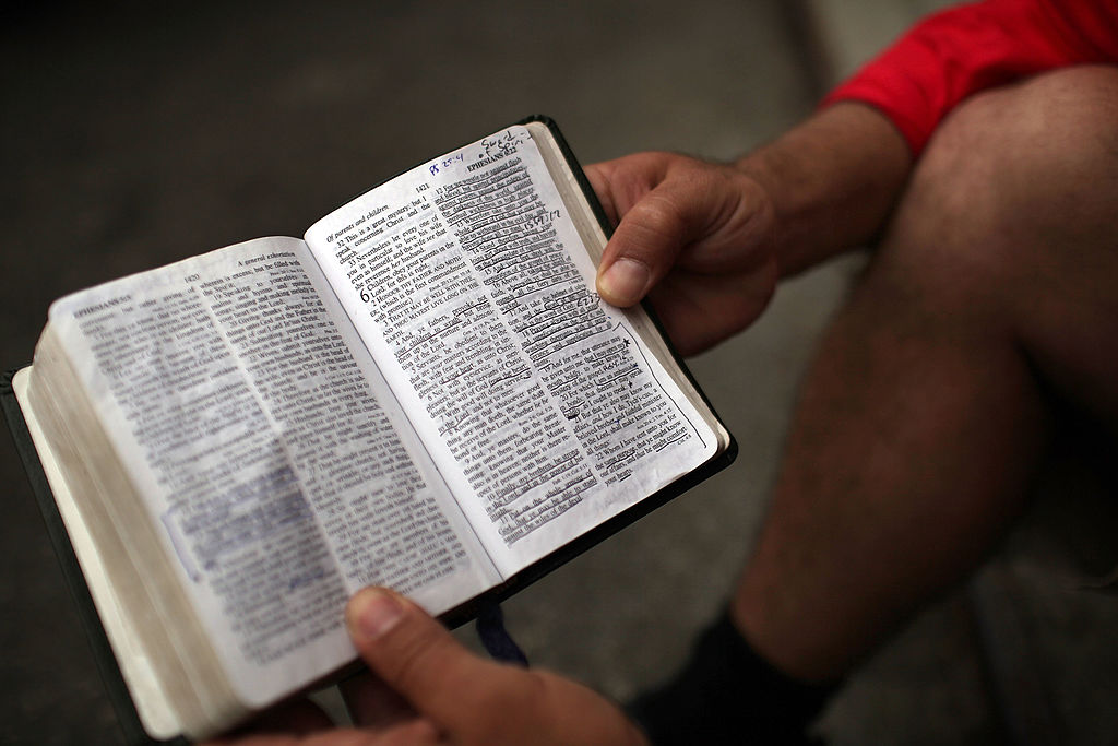 man holds a bible