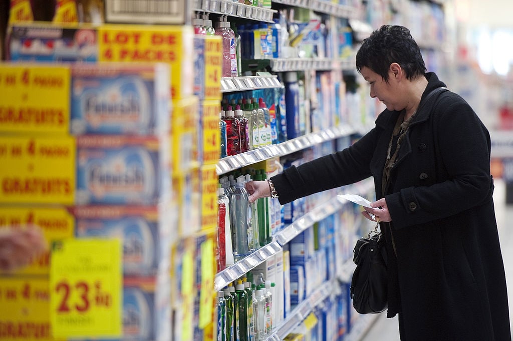 woman shops for cleaning supplies