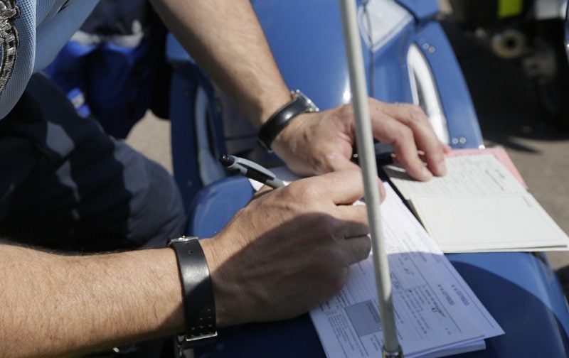 officer writing ticket