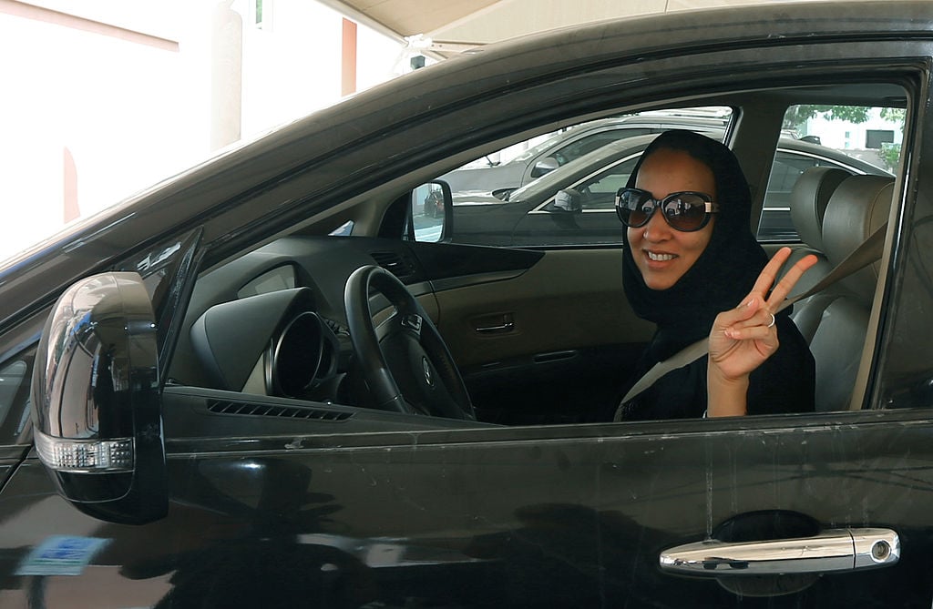 woman behind the wheel in saudi arabia woman driver with peace sign in Saudi Arabia