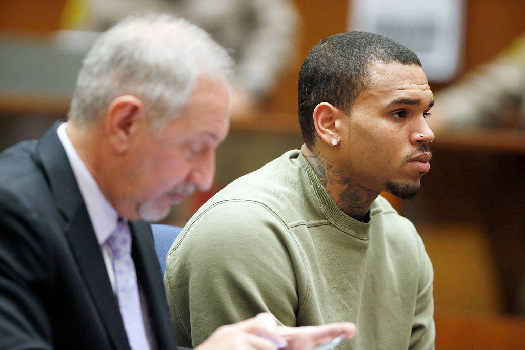 Singer Chris Brown attends a progress hearing at Los Angeles Superior Court. Brown was first placed on probation after the 2009 domestic violence case in which he plead guilty to assaulting his then-girlfriend, singer Rihanna. So stop buying his music Singer Chris Brown attends a progress hearing at Los Angeles Superior Court. Brown was first placed on probation after the 2009 domestic violence case in which he plead guilty to assaulting his then-girlfriend, singer Rihanna. So stop buying his music