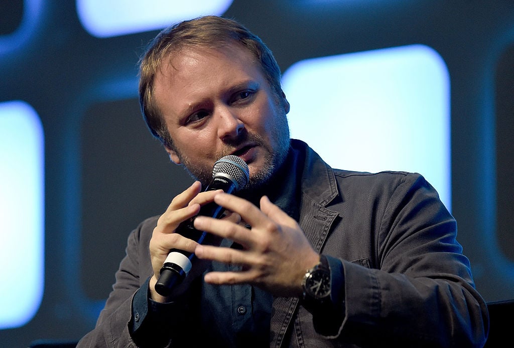 Rian Johnson speaking into a microphone at Star Wars Celebration Day. Rian Johnson speaking into a microphone at Star Wars Celebration Day.