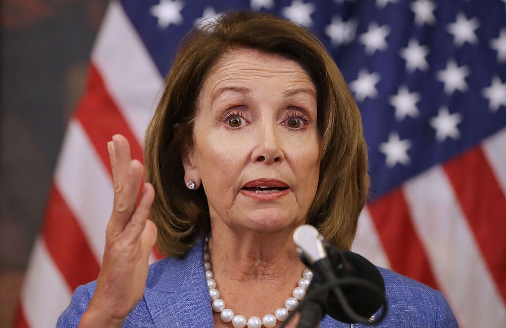 what sarah huckabee sanders said about nancy pelosi nancy pelosi giving a speech in front of an American flag