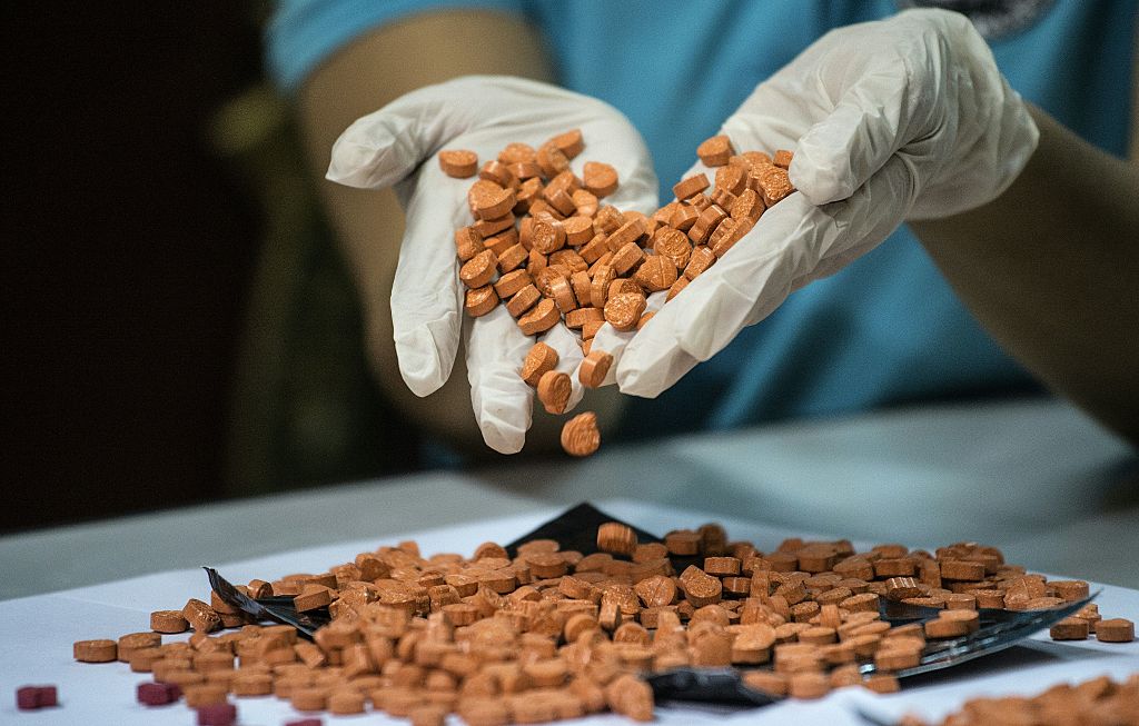 A Bureau of Customs (BOC) personnel displays confiscated illegal drugs, known Methylenedioxymethamphetamine (MDMA), commonly refered to as ecstasy, at a press conference at the BOC headquarters in Manila