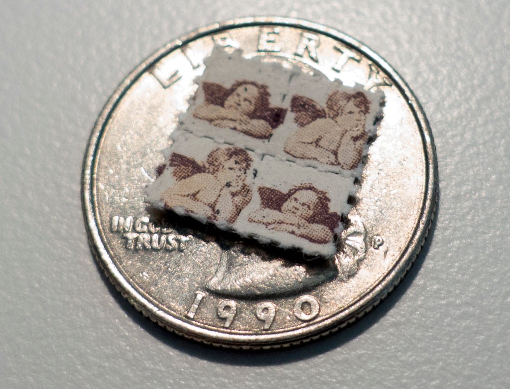This photo shows LSD blotter tabs on top of a US quarter coin This photo shows LSD blotter tabs on top of a US quarter coin