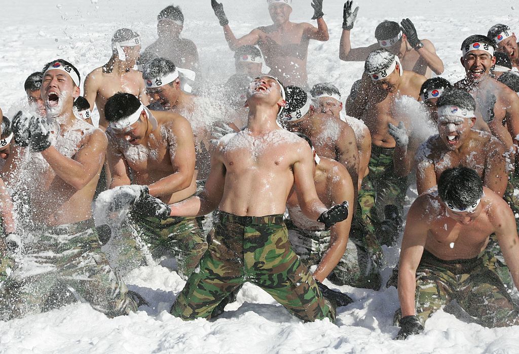 South Korean special warfare forces cover themselves in snow during winter mountain training exercises on January 10, 2007 in PyeongChang, South Korea.