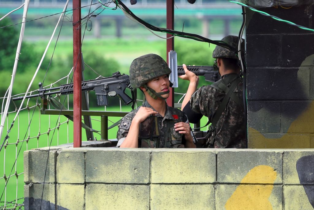 South Korean soldiers stand guard at a guard post near the Demilitarized Zone (DMZ) dividing two Koreas in the border city of Paju on August 11, 2017