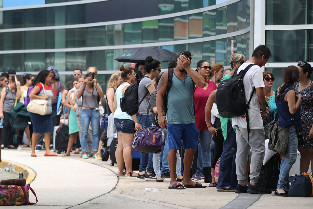 people waiting at an airport in Puerto Rico people waiting at an airport in Puerto Rico