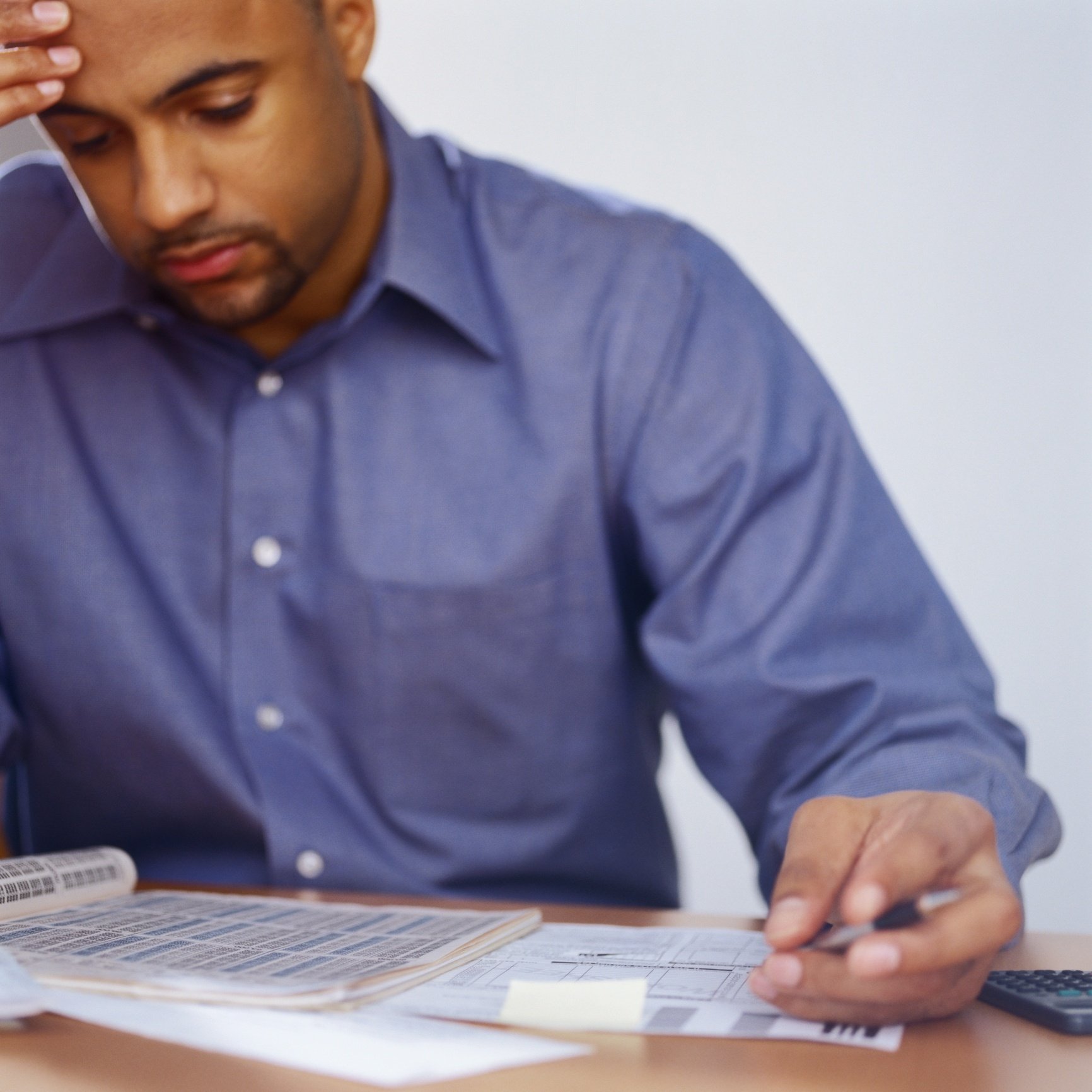 man doing taxes Man doing taxes