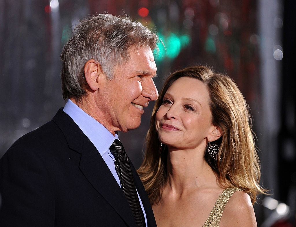 Harrison Ford and Calista Flockhart arrive at a movie premiere.