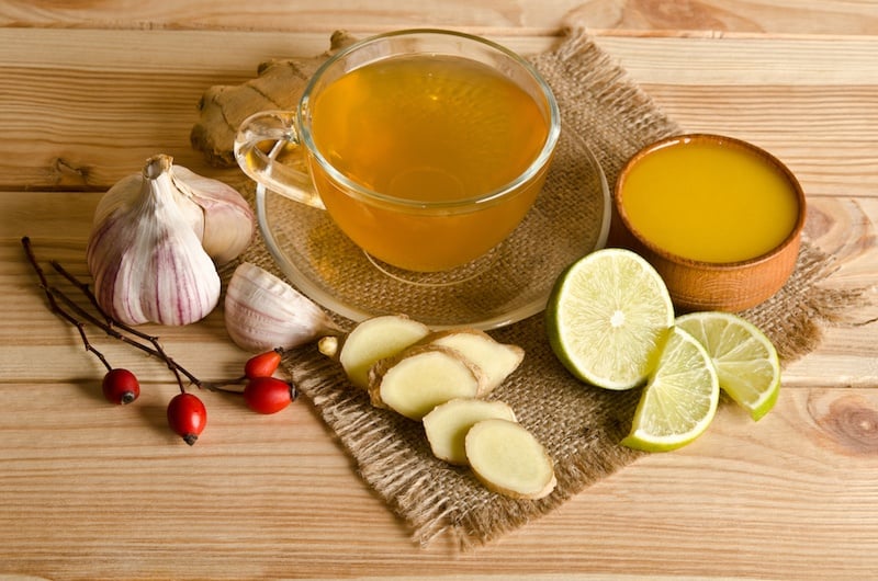 Cup of tea with lemon slices and ginger