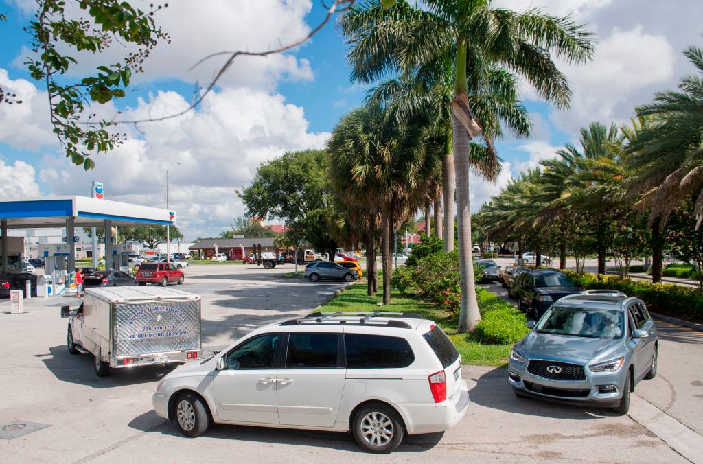People wait in line for gas before Hurricane Irma Gas lines stretch before Hurricane Irma