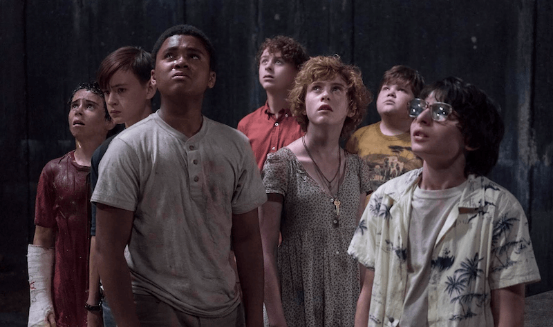 A gang of kids look upward. A gang of kids look upward.