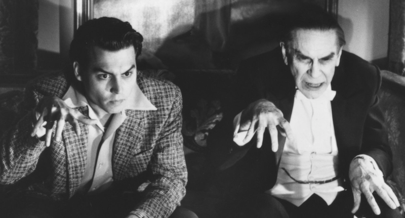 A black and white photo of Johnny Depp holding out his hand in 'Ed Wood'.