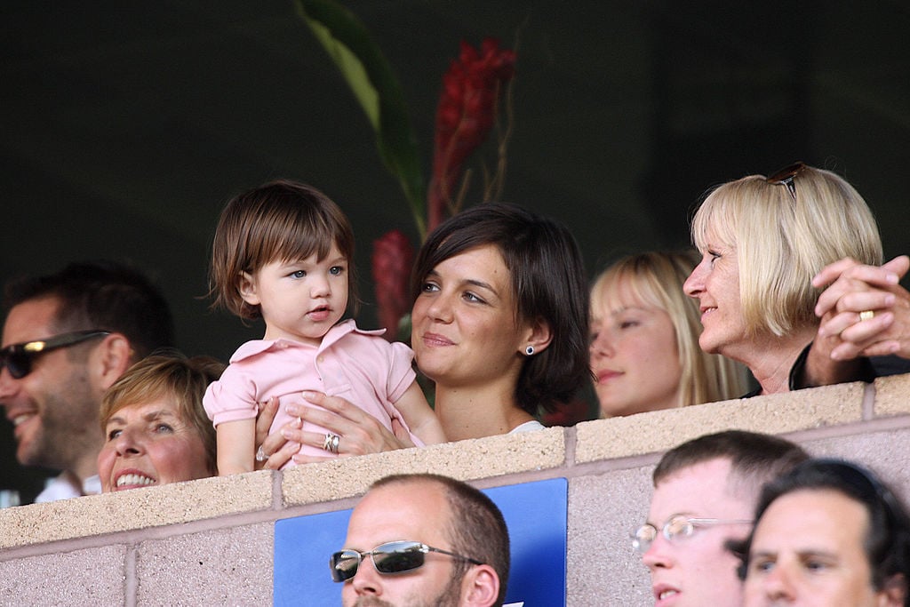 Katie Holmes holds her daughter Suri Cruise as they watch a soccer game. Katie Holmes holds her daughter Suri Cruise as they watch a soccer game.