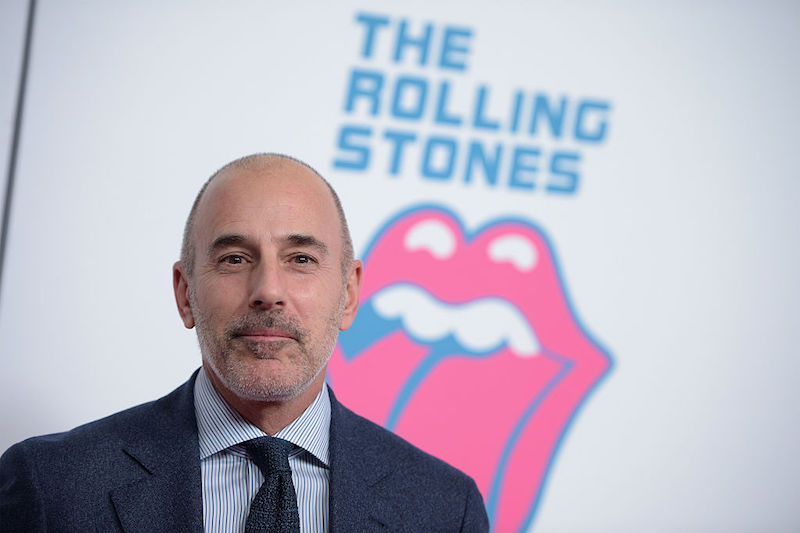Matt Lauer standing in front of a Rolling Stones sign while starting straight ahead. Matt Lauer standing in front of a Rolling Stones sign while starting straight ahead.