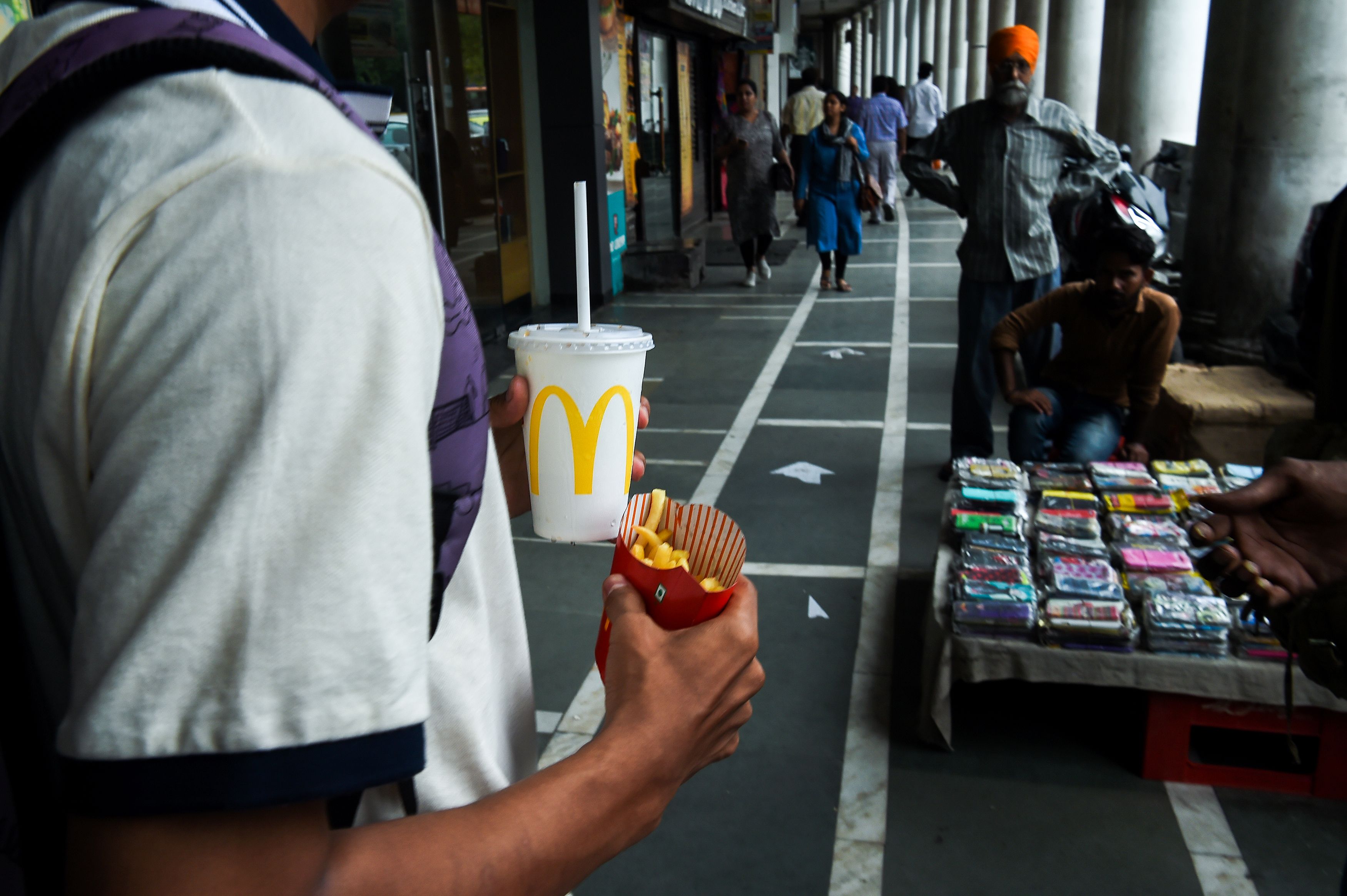 Man carrying a McDonald's meal