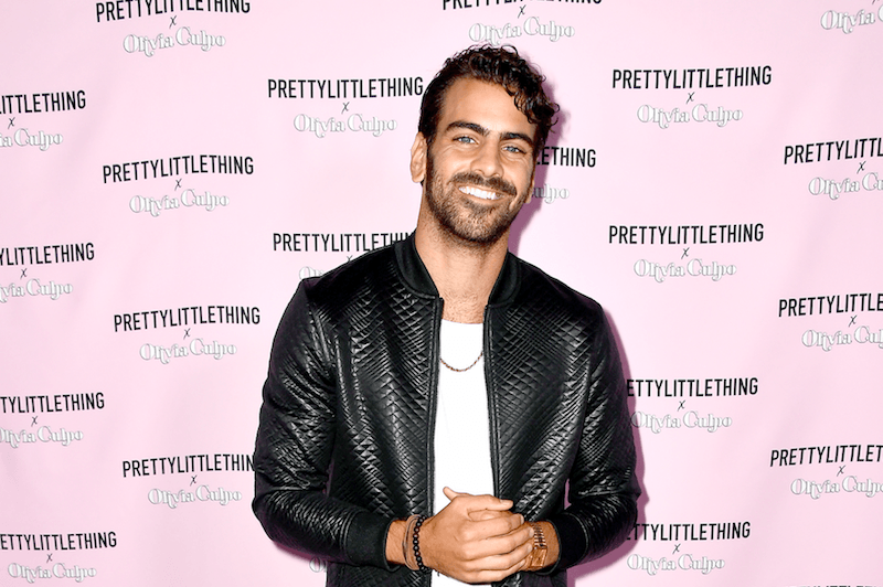 Nyle DiMarco poses in a leather jacket for a fashion launch in Los Angeles.