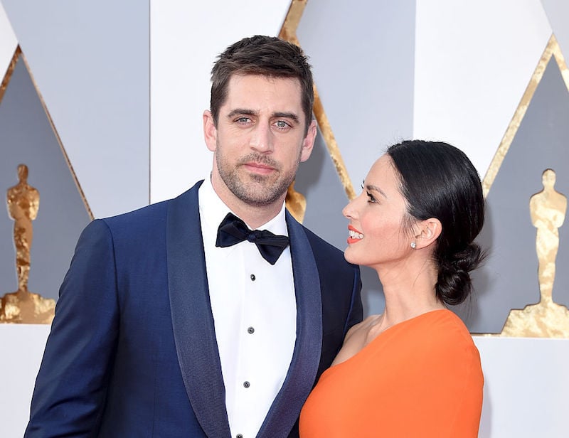 Aaron Rodgers and Olivia Munn posing at the 88th Annual Academy Awards.