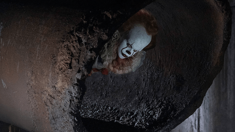 Pennywise sticks his head out of a sewer pipe Pennywise sticks his head out of a sewer pipe