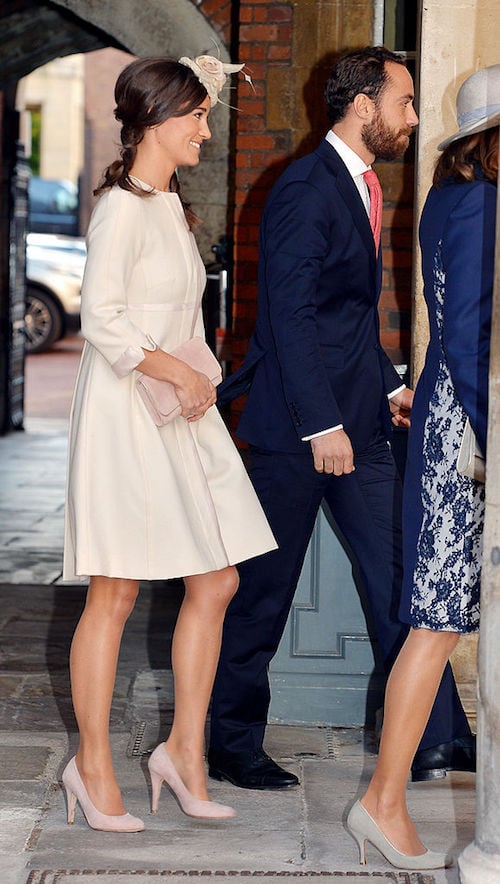 Kate Middleton walks with a crowd of people. Kate Middleton walks with a crowd of people.