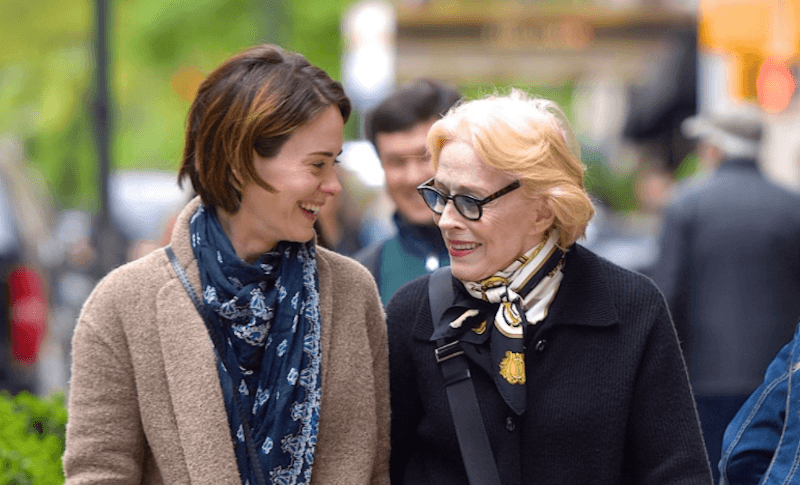 Sarah Paulson and Holland Taylor walk and talk together outside on the street. Sarah Paulson and Holland Taylor walk and talk together outside on the street.