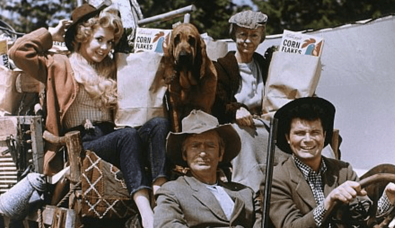 `Buddy, Max, Irene and the others sit together in a car as they do groceries. 