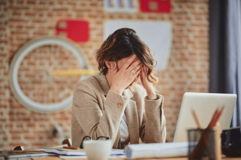 A businesswoman is stressed.