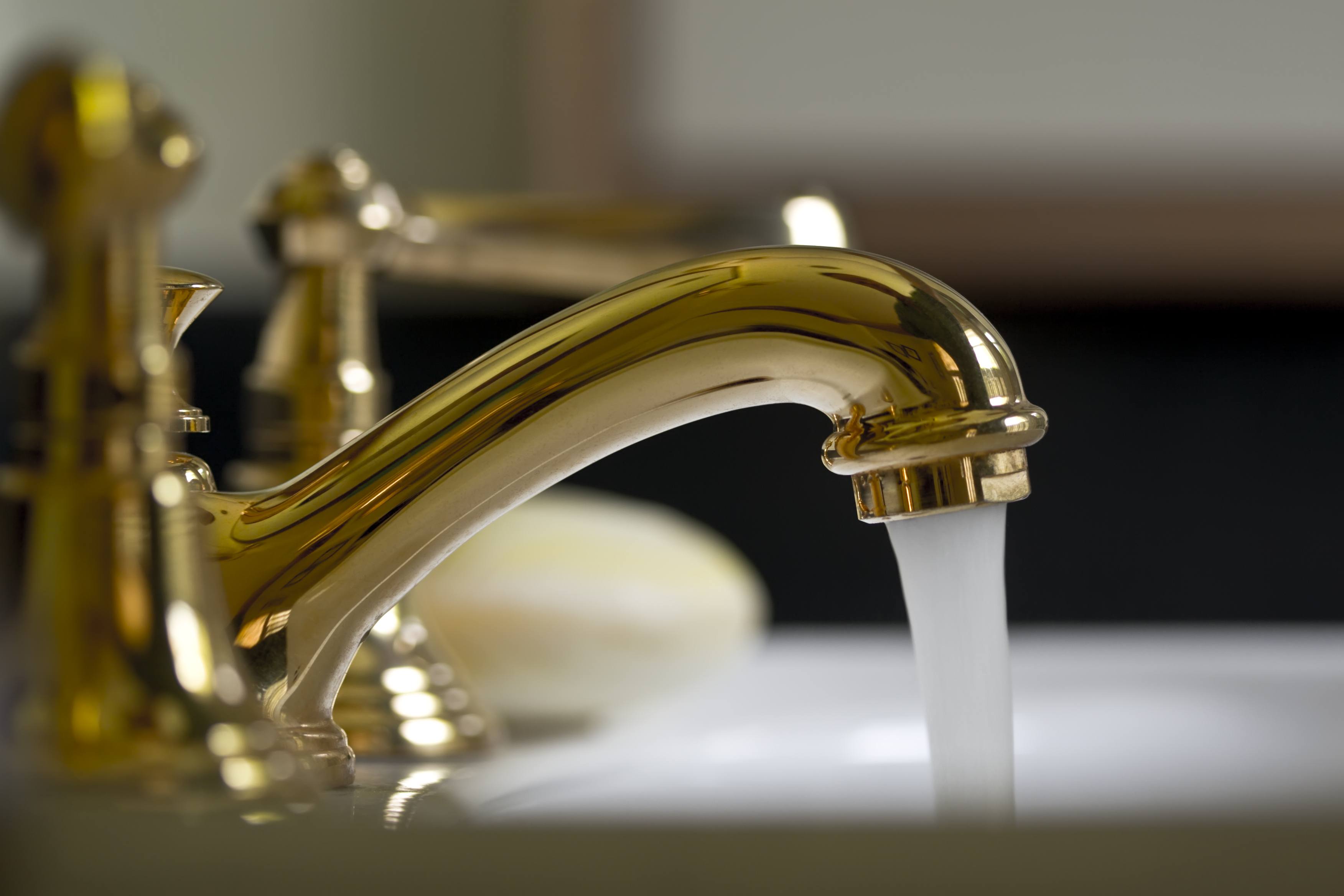 brass faucet in bathroom