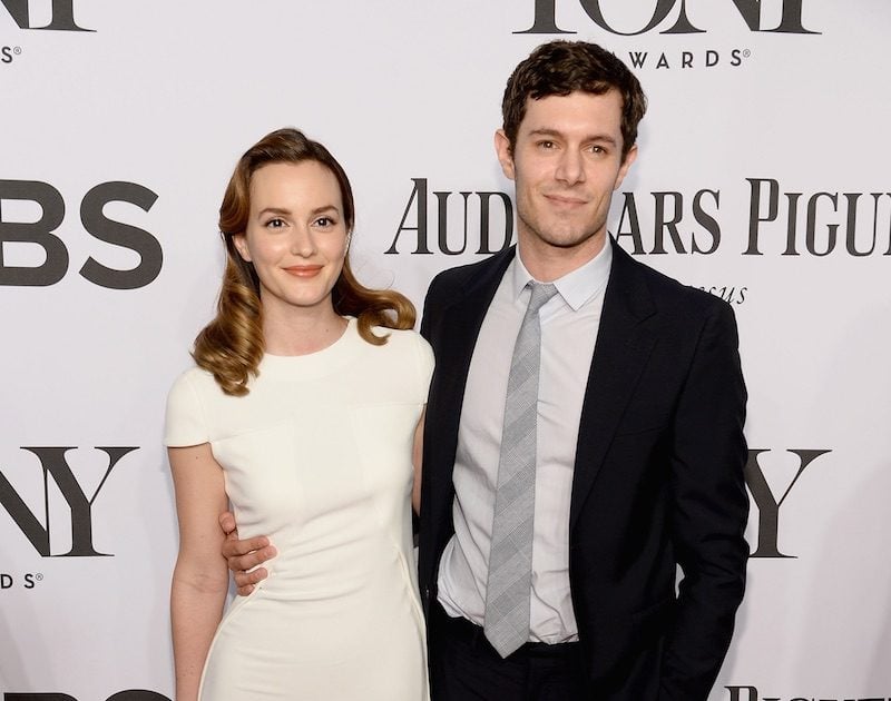 Leighton Meester and Adam Brody pose on the red carpet with their arms around each other. Leighton Meester and Adam Brody pose on the red carpet with their arms around each other.