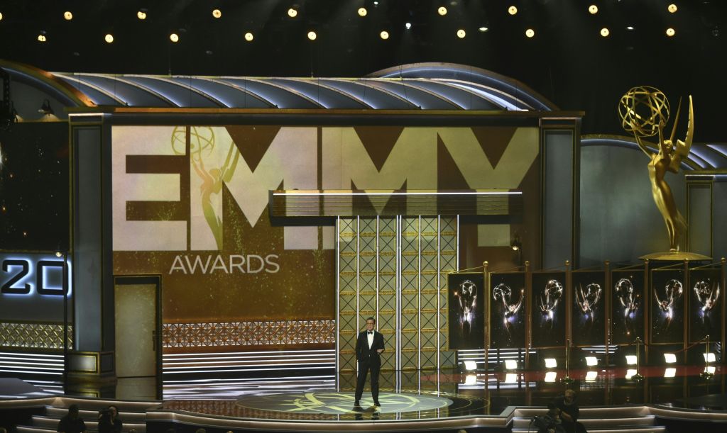 Stephen Colbert stands on the Emmys stage Stephen Colbert stands on the Emmys stage